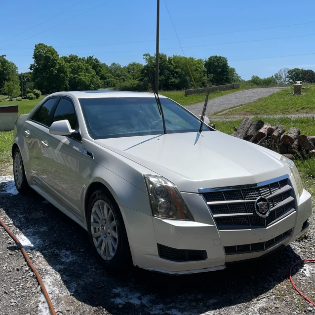 white Cadillac after a car wash